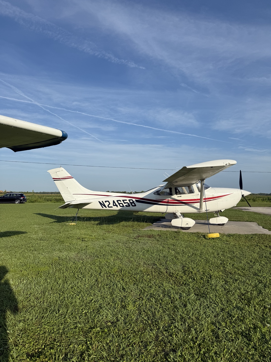 Cessna 182 parked on grass
